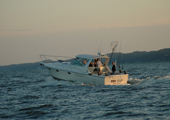 Charter Fishing Boat Heading into Lake Michigan