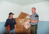 Michigan Department of Natural Resources Conservation Officer Inspecting Commercial Fish Processing House 